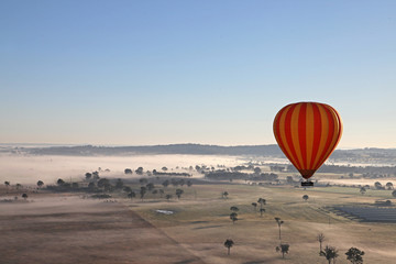Hot Air Balloon flight over Gold Coast Hinterland, Queensland, Australia at sunrise in mid winter
