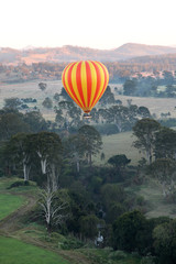 Naklejka premium Hot Air Balloon flight over Gold Coast Hinterland, Queensland, Australia at sunrise in mid winter