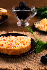 Toasted toast sandwich with baked grated cheese and crab meat.