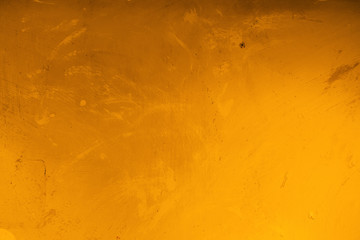Abstract grunge surface orange bronze gold background golden yellow highlights