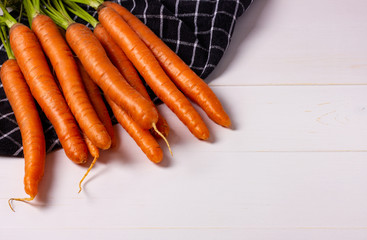 Bunch of raw carrots on white background.