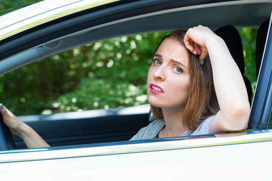 Stressed Young Woman Upset About Traffic In A New Car