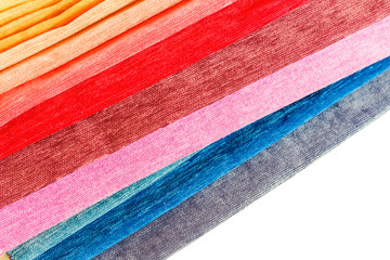 Colorful fabric samples. Bright collection of cloth close-up on white background