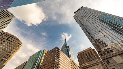 Looking up to the sky from the city sidewalk