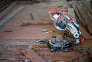 Man doing woodwork in carpentry. Carpenter work on wood plank in workshop
