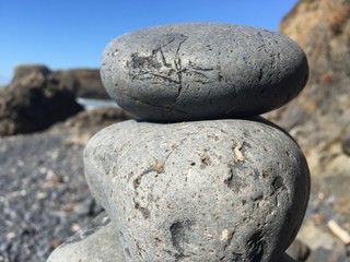 Fototapeta na wymiar Stacked Rocks On Beach - Cairn