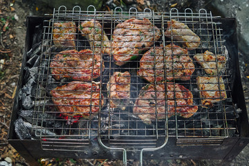 Picture of meat cooked on charcoal.