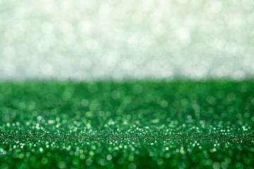 Abstract green and silver sparkling bokeh wall and floor background studio.luxury holiday backdrop...