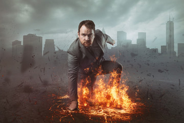 Superhero businessman concept with fire and city background