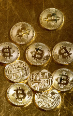 Bitcoin coins on gold color