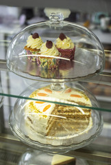 Pastries and cakes on showcase in the pastry shop.