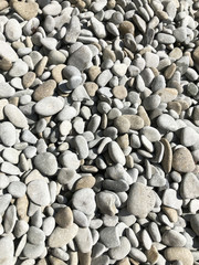 Small smooth stones treated with sea water. Pebble beach on the Black Sea coast