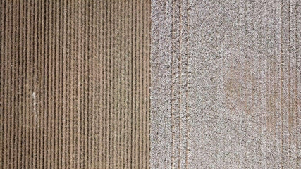 Aerial image of a vast Cotton field showing both pre and post harvest parts of the field.