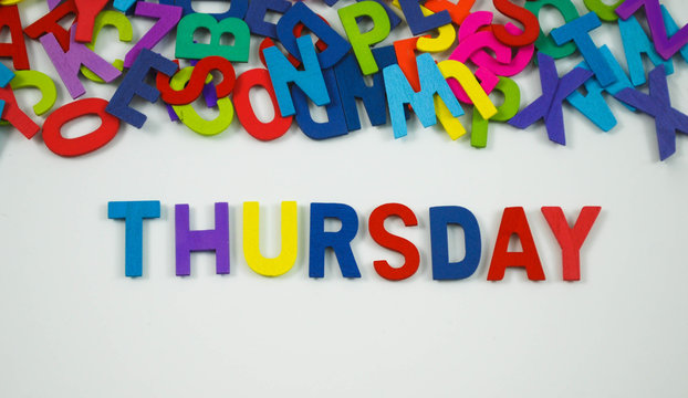 Colorful wooden alphabet wit text thursday