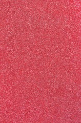 shimmering RED background in glittery material ideal as a very bright backdrop