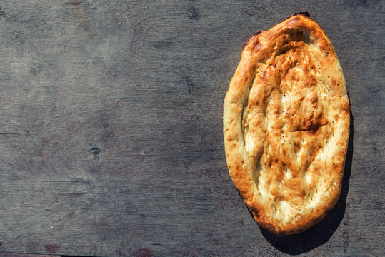Traditional eastern bread on wooden background