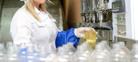 Sunflower oil factory. Factory line of production and filling of refined oil from sunflower seeds.