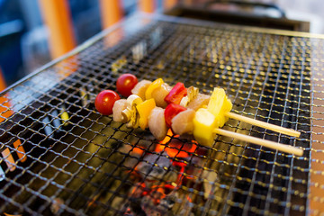 Home made barbecue (BBQ) with pork has a variety of fruits