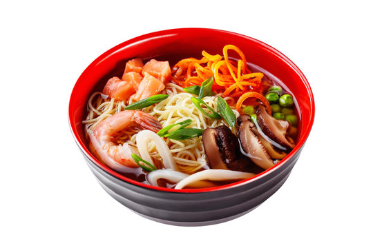 Top view image of japanese ramen soup with noodles, salmon, mushrooms and seafood isolated at white background.