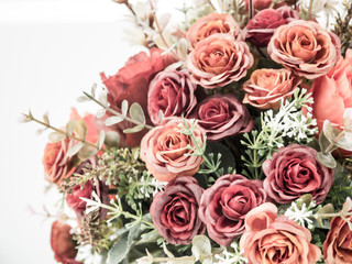 Plastic roses in artificial flower bouquet