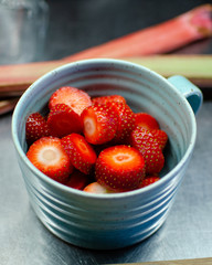 Mug filled with fresh sliced strawberries