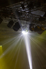 Stage lights. Soffits. Concert light. Silver mirror disco ball in the rays of the spotlights