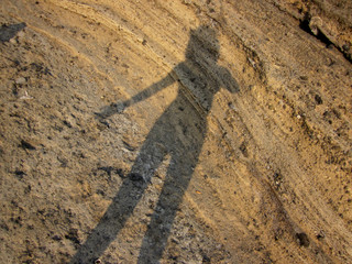 shadow on the rocks: portret of a photographer in Procida © Moniek
