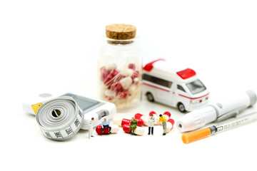 Miniature people : Doctor with patient in medical office with worker take Piill capsules,Health care concept.