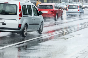 car traffic during rush hours. flooded city road during heavy rain