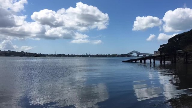 Time lapse of Herne Bay and Auckland harbor bridge in Auckland New Zealand