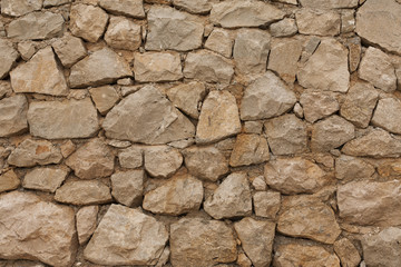 background stone wall of yellow color