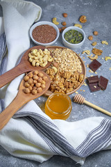 Various nuts on stone table. Top view with copy space