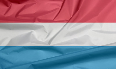 Fabric flag of Luxembourg. Crease of Luxmbourg flag background, horizontal red white and light blue.