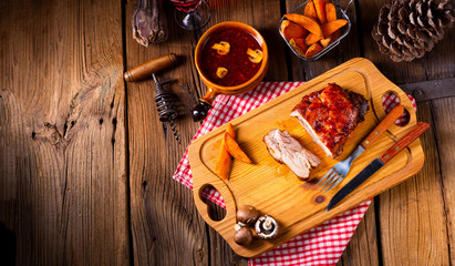 spicy roasted meat with mushroom sauce in the oven