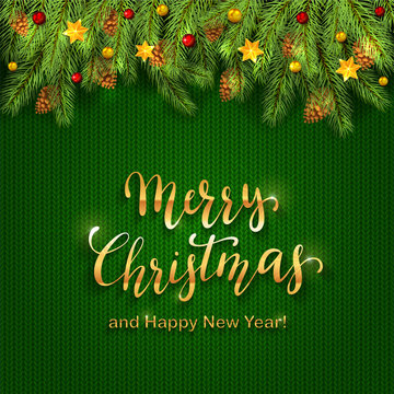 Christmas lettering on green knitted background with holiday decorations