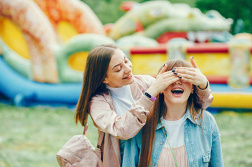 Obraz premium Beautiful ladys walk in the park. 