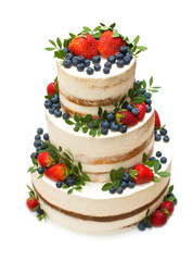 Wedding cake with strawberries and wild berries isolated on white background