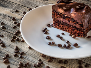 Slice of cake with cream coffee and coffee beans