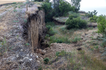 Mountain landslide disaster in sesmically dangerous area. Large cracks in earth, descent of large...