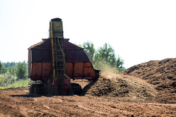Special equipment for collecting peat. Peat extraction process. Agriculture industry, peat farm