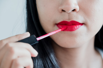 Red Lipstick. Closeup Of Woman Face With Bright Red Matte Lipstick On Full Lips. Beauty Cosmetics,...
