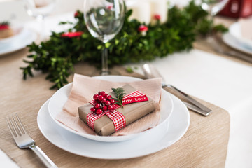 A table set for a dinner at home at Christmas time.