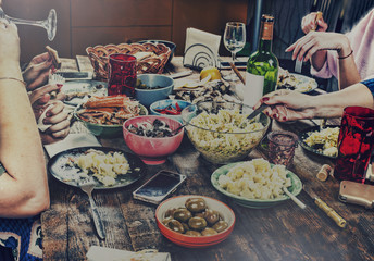 Dining family table. Easter. Various snacks and Easter wine. close up