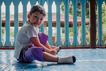 Little student hands putting on socks by herself - children development by learning to do things by themselves