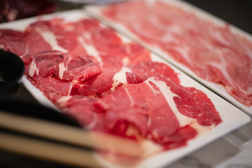 pink thin sliced beef with fat for shabu, suki