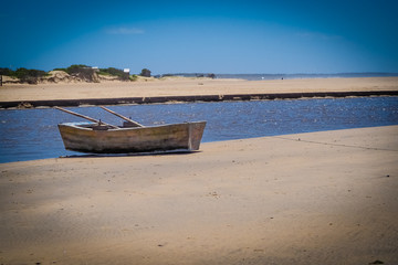 Naklejka na ściany i meble Little boat in Barra de valizas, Uruguay, near Cabo Polonio