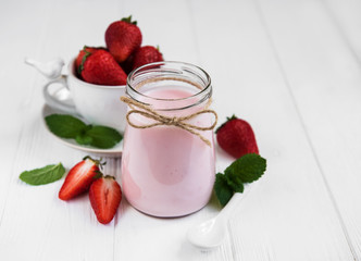 Jar with strawberry yogurt