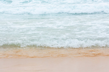 Wave of the sea on the sand beach.
