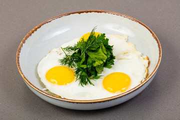 Fried eggs with herbs