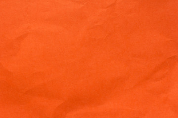 Texture of old orange crumpled paper cardboard for background 